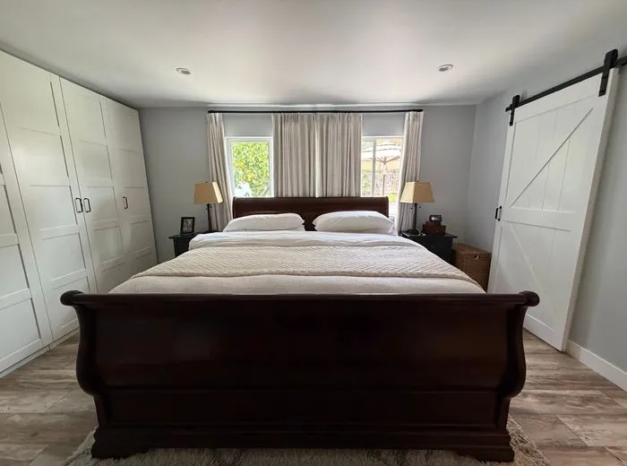 Freshly made bed in a clean, guest-ready bedroom