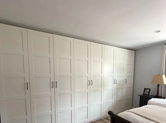 Neatly arranged bedroom wardrobe wall