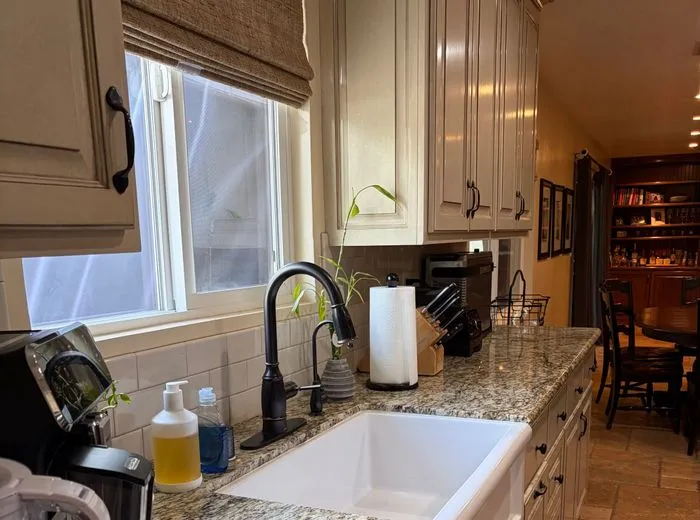 Clean double vanity bathroom with polished mirror and counters