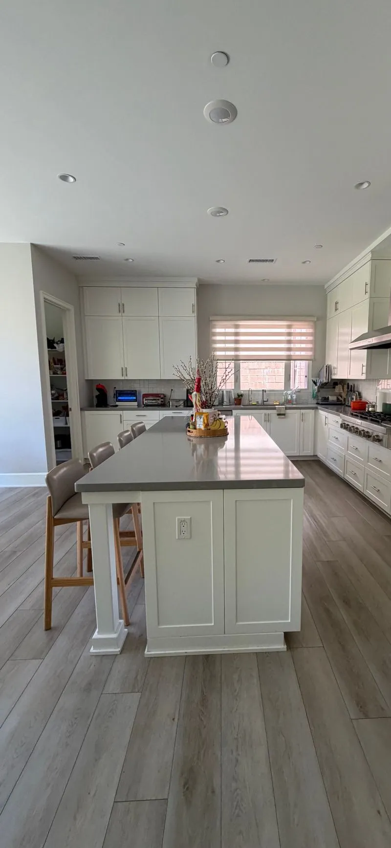 Large kitchen with a clean island and counters