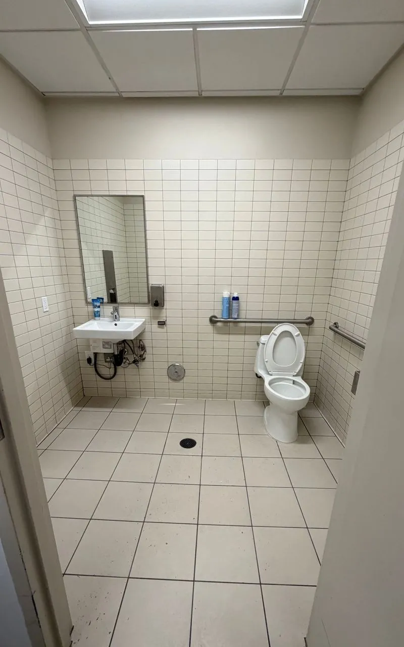 Clean commercial restroom with white tile