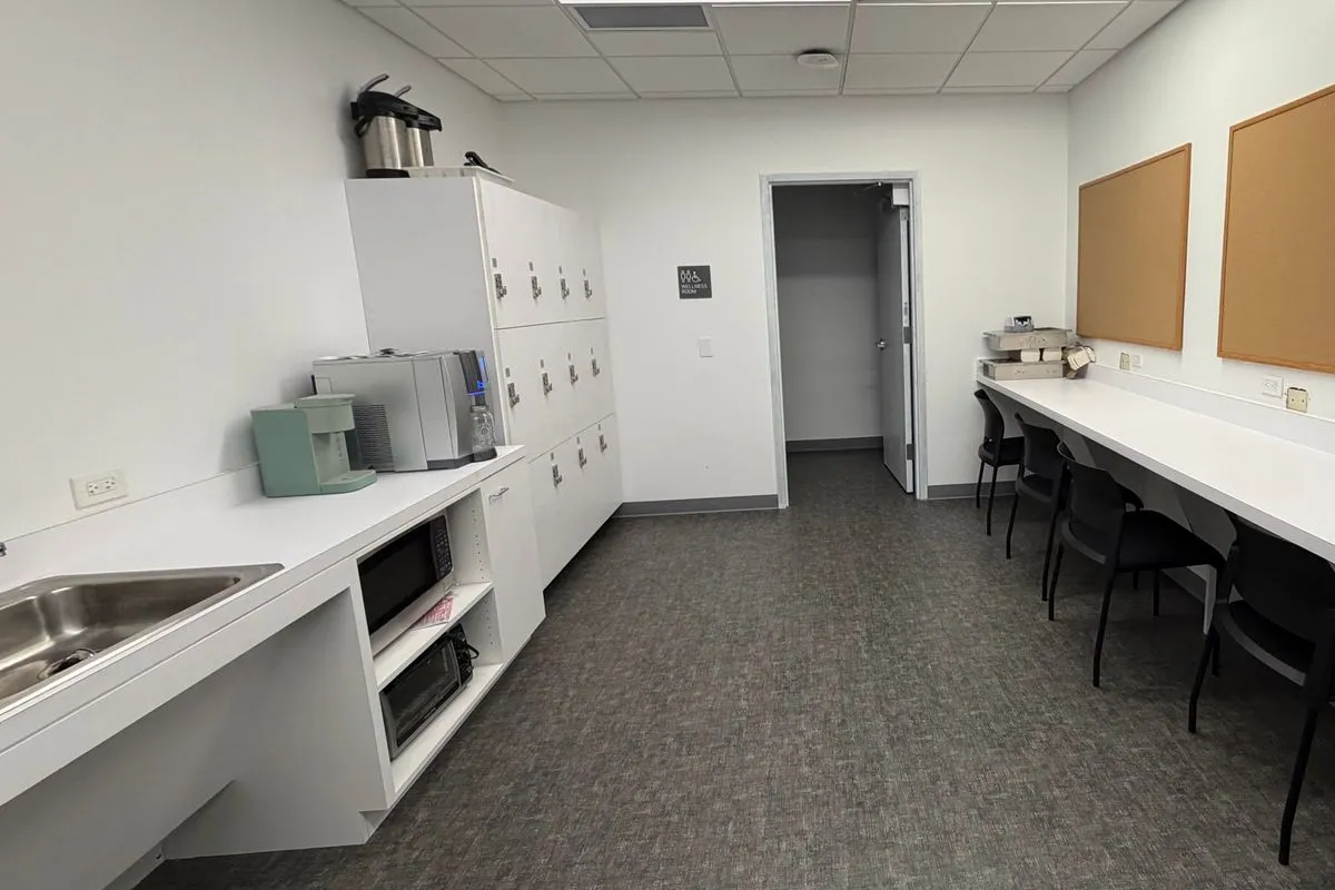 Clean office breakroom with wiped counters and appliances